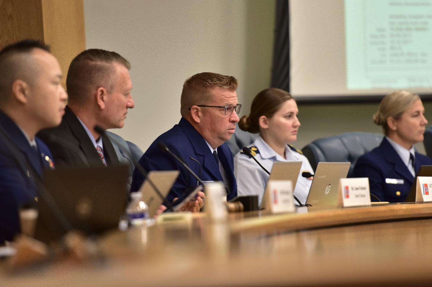 Lt. Commander Thomas Whalen, U.S. Coast Guard Marine Board of Investigation lead investigator, center, asks questions during witness testimony, Wednesday, Sept. 25, 2024, at the U.S. Coast Guard Marine Board of Investigation hearing into the June 2023 loss of the Titan submersible, in North Charleston, S.C. (Petty Officer 2nd Class Kate Kilroy/U.S. Coast Guard via AP, Pool)