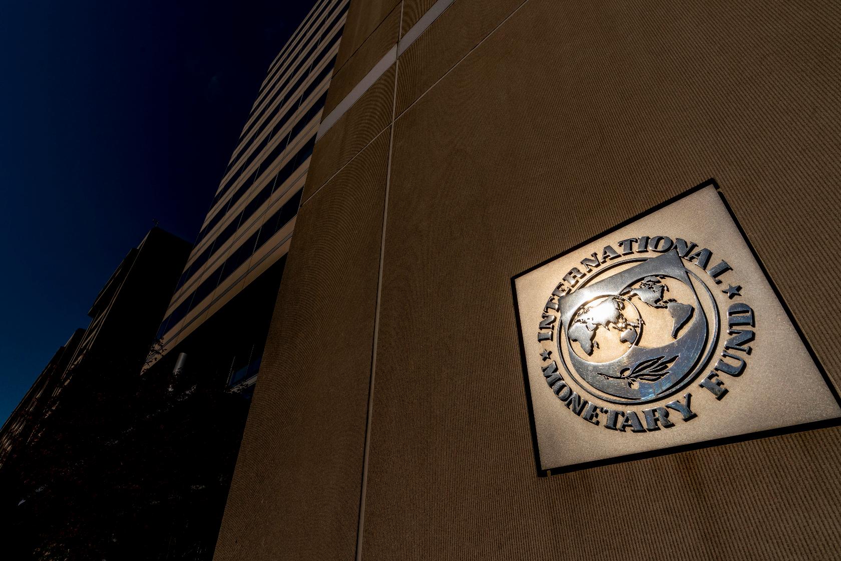 FILE - The International Monetary Fund building, Monday, April 5, 2021, in Washington. (AP Photo/Andrew Harnik, File)