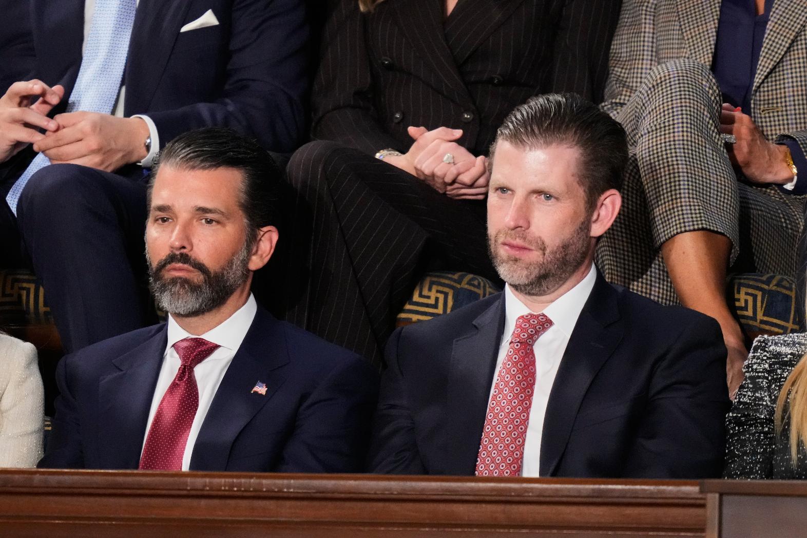 FILE - Donald Trump Jr. and Eric Trump listen to President Donald Trump's State of the Union address at the U.S. Capitol in Washington, Feb. 24, 2026. (AP Photo/Alex Brandon, file)