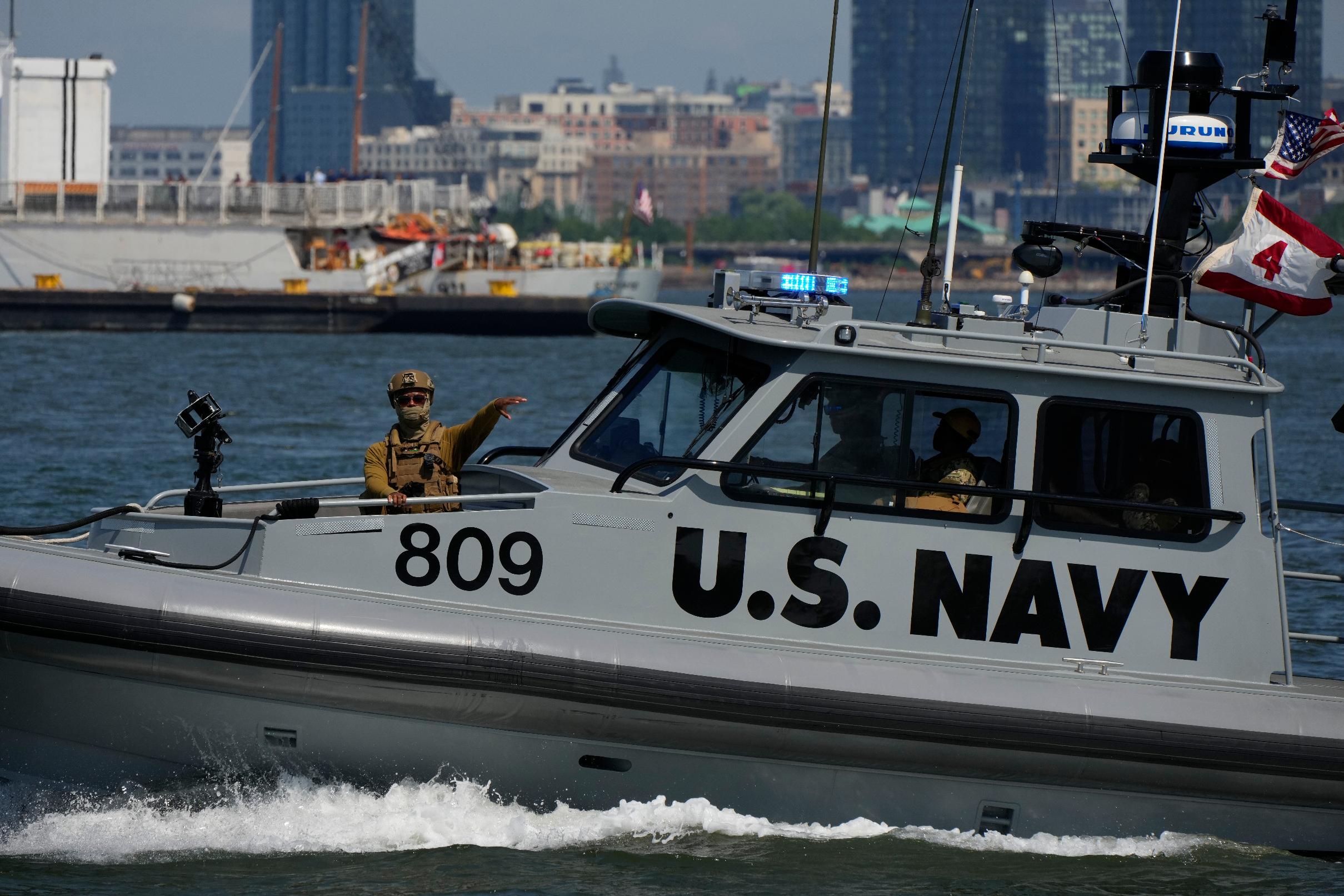 A U.S. Navy boat patrols the New York harbor during Sail250, a gathering of tall ships and military ships, Saturday, July 4, 2026, in New York. (AP Photo/Yuki Iwamura)