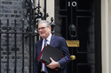 Prime Minister Sir Keir Starmer departs 10 Downing Street to attend Prime Minister's Questions at the Houses of Parliament in London, England, Wednesday, March 12, 2025. (Stefan Rousseau/PA via AP)