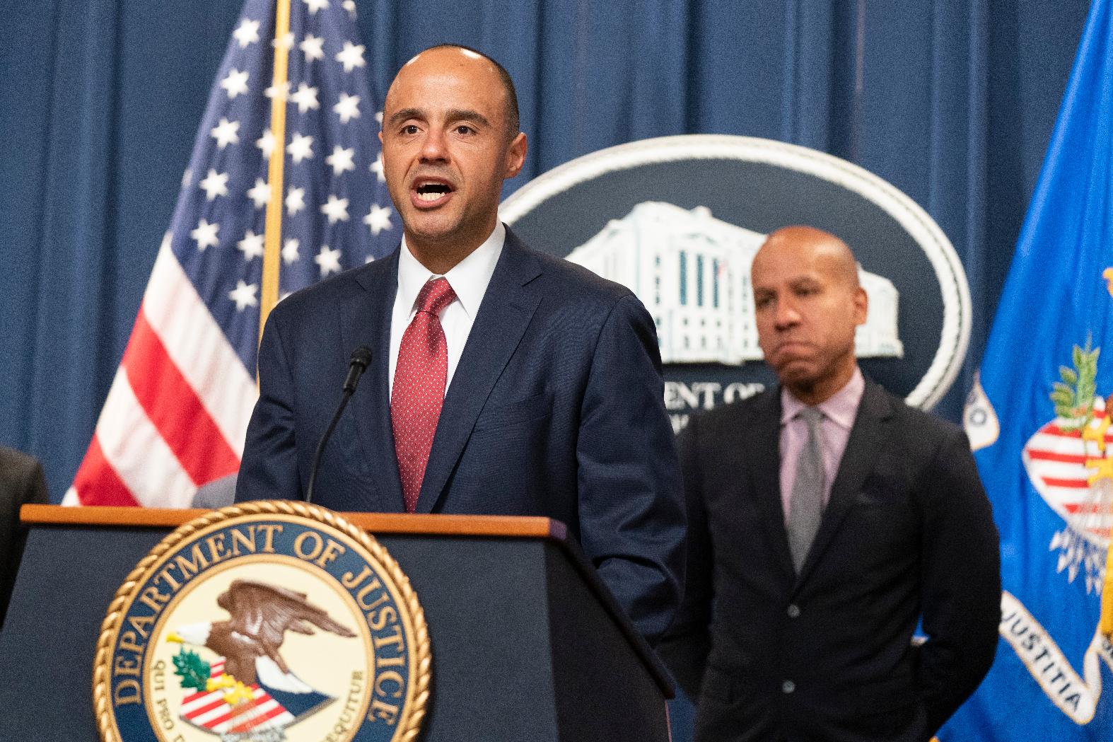U.S. Attorney Matthew Graves for the District of Columbia, with Under Secretary of the Treasury for Terrorism and Financial Intelligence Brian Nelson, right, speaks during a news conference, Tuesday, April 25, 2023, at the Justice Department in Washington. The Justice Department says British American Tobacco has agreed to a $629 million settlement to resolve allegations that it did illegal business with North Korea. In addition, federal prosecutors disclosed a cigarette trafficking scheme that raised money for North Korea's nuclear weapons program, announcing charges against three men — a North Korean banker and two Chinese facilitators. (AP Photo/Manuel Balce Ceneta)