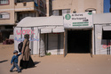 Palestinian graphic designer Reem Alkhateeb, 33, and her son Ahmed arrive at a tent that was converted into a coworking space in Khan Younis, southern Gaza Strip, March 9, 2026. (AP Photo/Abdel Kareem Hana)