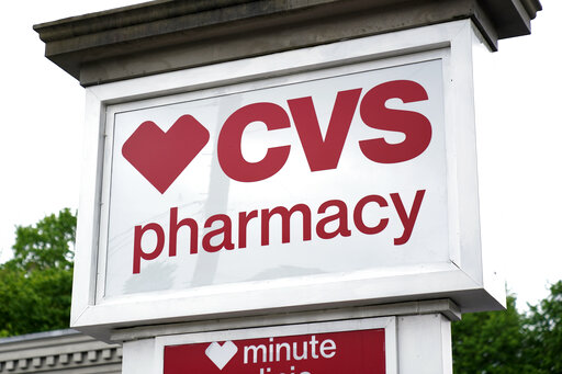 FILE - A CVS Pharmacy sign stands in Mount Lebanon, Pa., on Monday May 3, 2021. CVS Health said Tuesday, Aug. 2, 2022, that it thumped second-quarter expectations and hiked its full-year forecast as growing prescription claims and COVID-19 test kits sales helped balance a drop in vaccinations for the health care giant. (AP Photo/Gene J. Puskar, File)