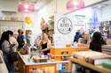 Co-owners Anika Omark, lcenter eft, and Matthew Hein, center right, appear behind the counter at their bookstore, Hey Books!, in San Diego on April 26, 2026. (Rachyel P. Magaña/Hey books! via AP)