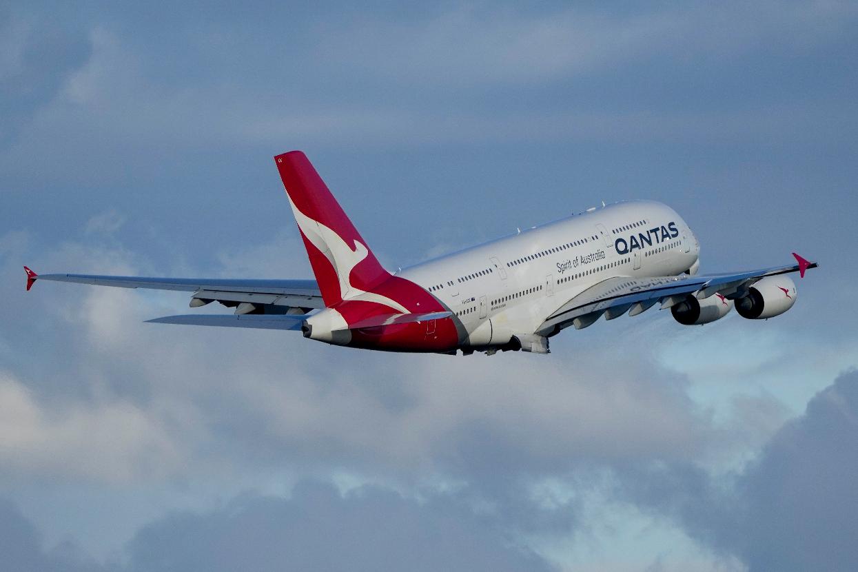 FILE - A Qantas A380 takes off from Sydney Airport over Botany Bay in Sydney, Australia, Monday, Sept. 5, 2022. Australian national carrier Qantas posted an underlying pre-tax half-year profit of 1.43 billion Australian dollars ($978 million) on Thursday, Feb. 23, 2023, in the airline's first return to profit since the coronavirus pandemic started three years ago. (AP Photo/Mark Baker/File)