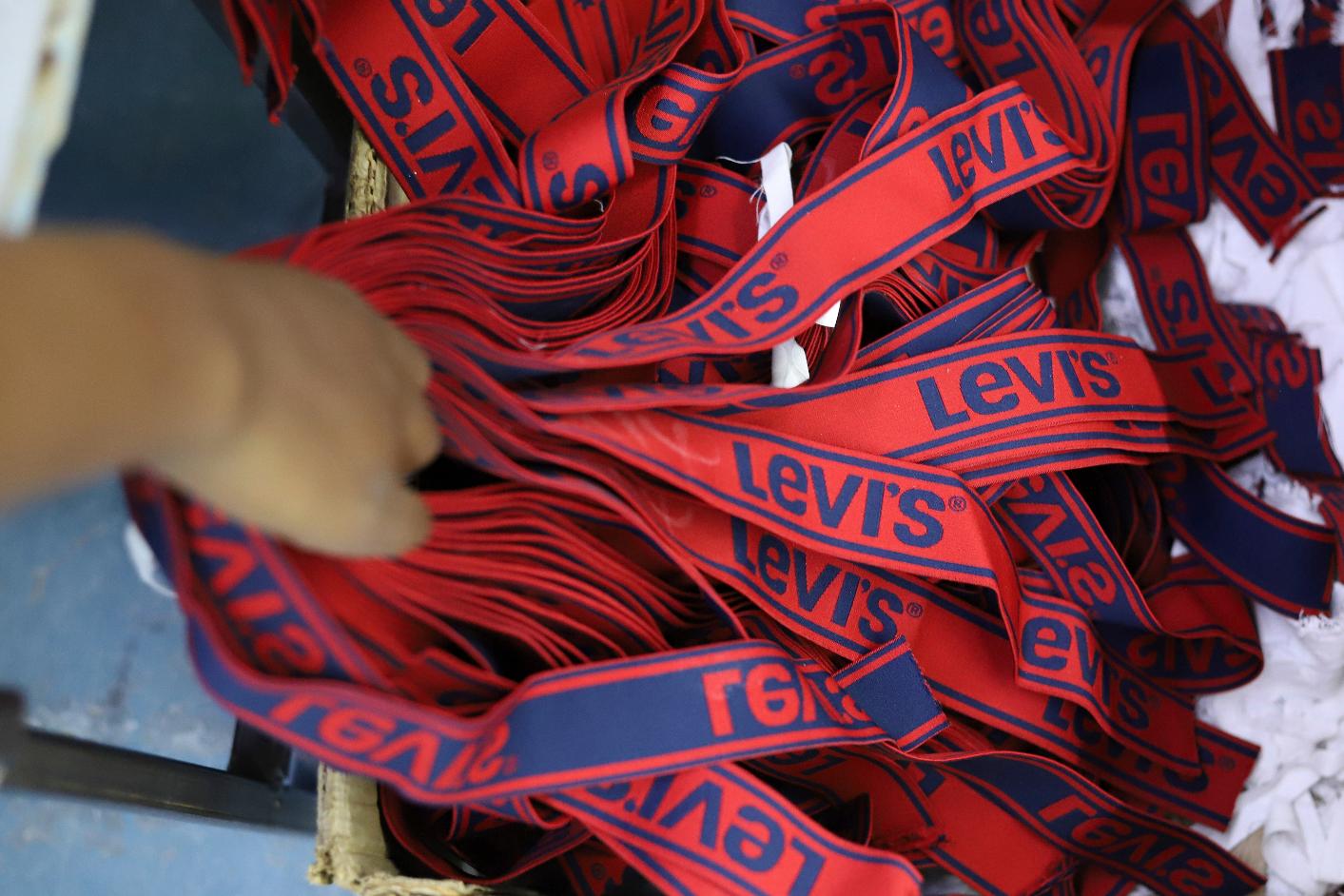 FILE - A label reading "Levis" on a pair of Levi Strauss & Co jeans is displayed at a production line at United Aryan EPZ Limited in Ruaraka on the outskirts of Nairobi, Kenya, March 21, 2025. (AP Photo/Andrew Kasuku, File)