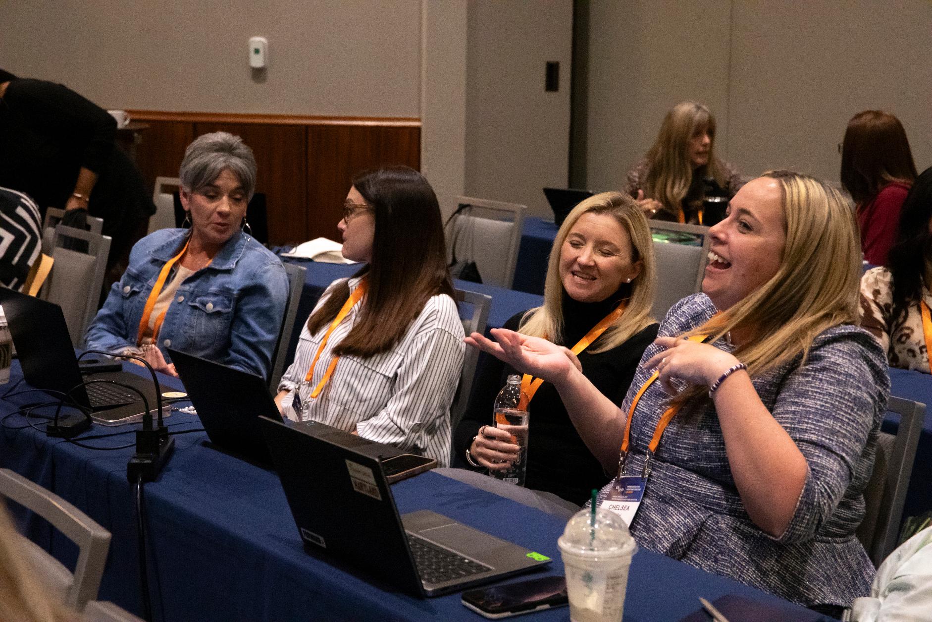 Administrators discuss their use of AI during "How To Use AI To Think and Influence at the Executive Level," an administrative training session, Wednesday, April 22, 2026, in Boston. (AP Photo/Sydney Roth)