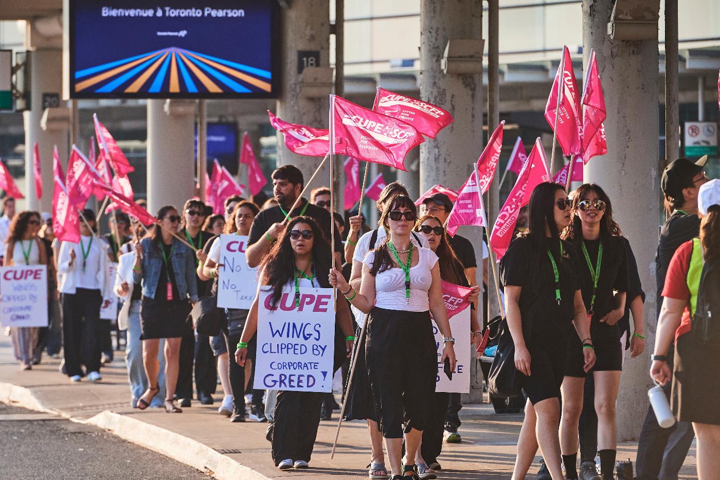 Air Canada flight attendants picket at Pearson International Airport in Toronto on Saturday, Aug. 16, 2025. (Sammy Kogan/The Canadian Press via AP)