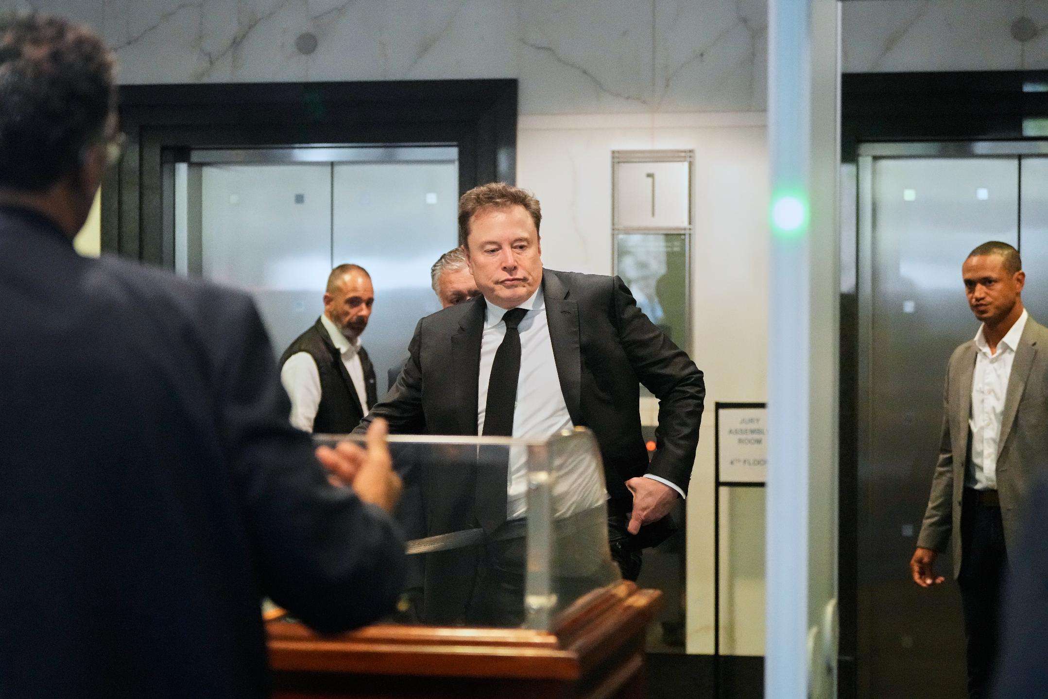 Elon Musk arrives at the U.S. District Court in Oakland, Calif., Tuesday, April 28, 2026. (AP Photo/Godofredo A. Vásquez)