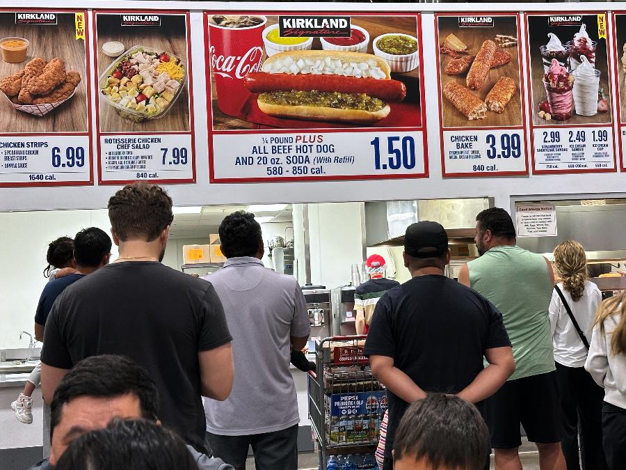 Customers wait their order in a food court at a wholesale store in Mount Prospect, Ill., Monday, June 8, 2026. (AP Photo/Nam Y. Huh)
