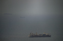A cargo ship sails in the Persian Gulf toward the Strait of Hormuz, Wednesday, April 22, 2026. (AP Photo)