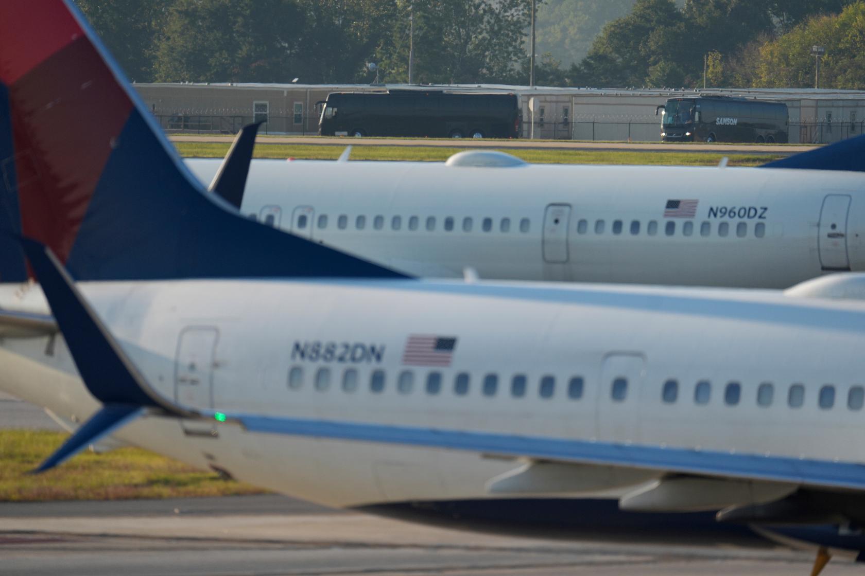 Buses carrying Korean workers detained arrives at Hartsfield-Jackson International Airport in Atlanta, Thursday, Sept. 11, 2025. (AP Photo/George Walker IV)