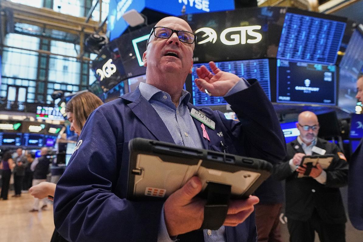 Trader Patrick Casey works on the floor of the New York Stock Exchange, Wednesday, May 13, 2026. (AP Photo/Richard Drew)