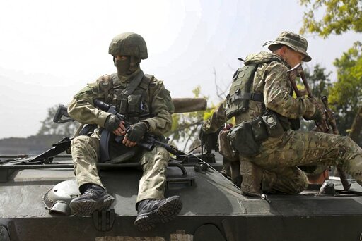 FILE - In this handout photo taken from video released by Russian Defense Ministry Press Service on Thursday, Sept. 8, 2022, Russian paratroopers are seen on a mission on the Nikolaev-Krivoy Rog direction in Ukraine. (Russian Defense Ministry Press Service via AP, File)