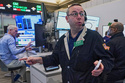 Options trader Matthew Hefter, center, works on the floor of the New York Stock Exchange, Thursday, April 23, 2026. (AP Photo/Richard Drew)