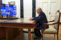 Russian President Vladimir Putin chairs a meeting with members of the Security Council via videoconference at the Kremlin in Moscow, Russia, Friday, March 13, 2026. (Gavriil Grigorov, Sputnik, Kremlin Pool Photo via AP)