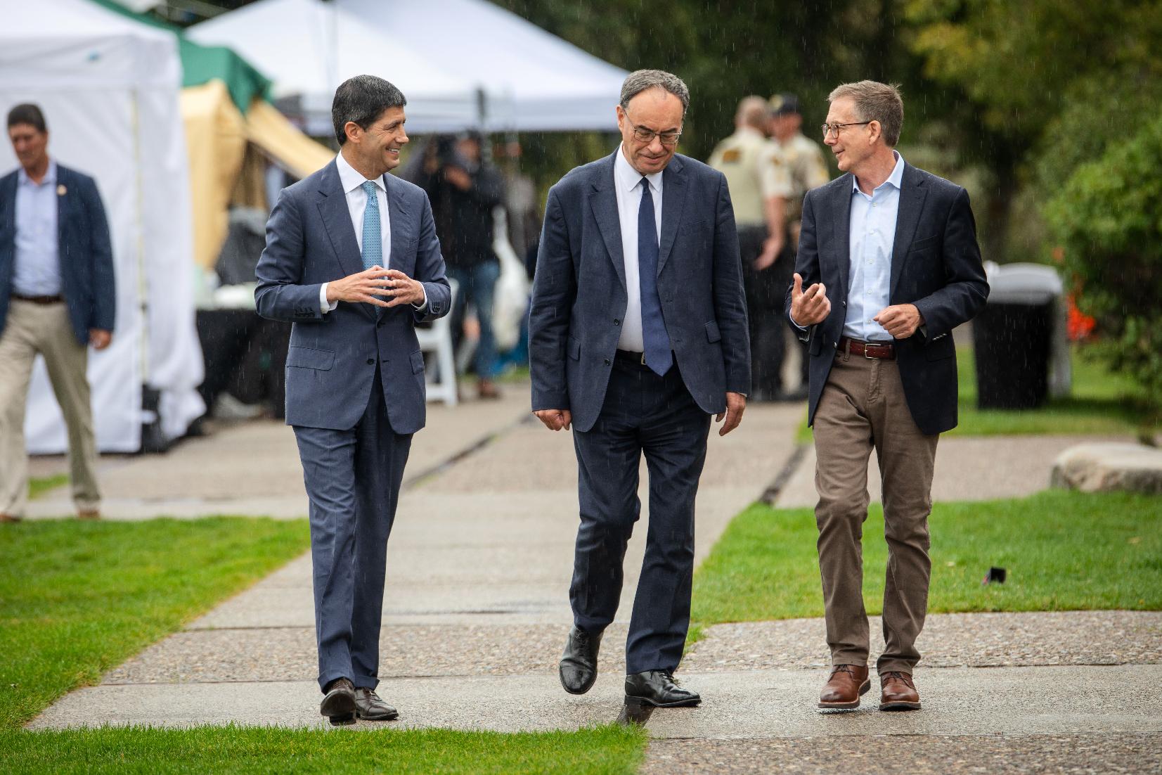 Fed Chair Kevin Warsh, left, Bank of England Governor Andrew Bailey, middle, and Bank of Canada Governor Tiff Macklem arrive at the annual Jackson Hole Economic Policy Symposium on Friday, Aug. 28, 2026, in Moran, Wyo. (AP Photo/Amber Baesler)
