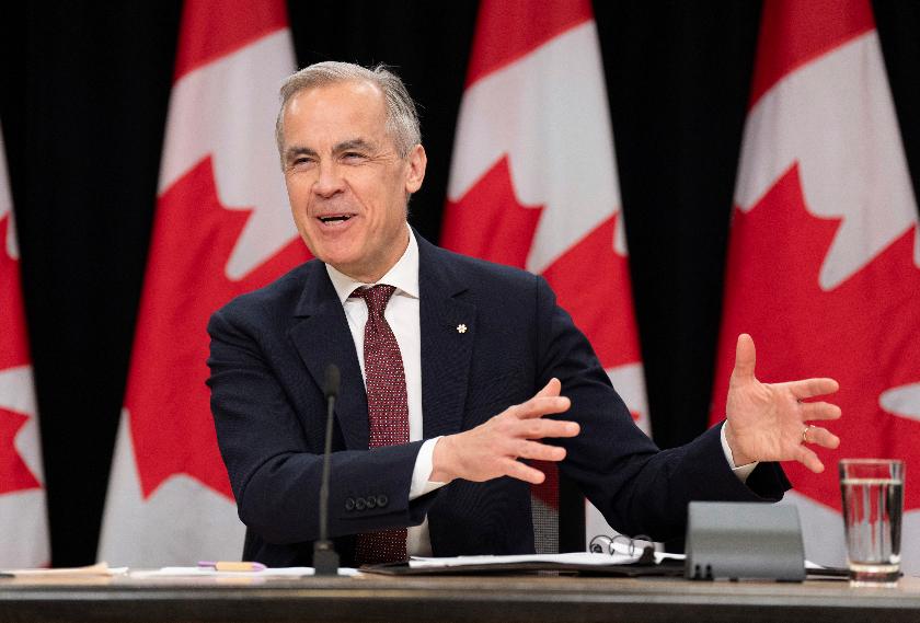 Prime Minister Mark Carney laughs as he responds to a question during a news conference, in Ottawa, Friday, May 2, 2025. (Adrian Wyld /The Canadian Press via AP)