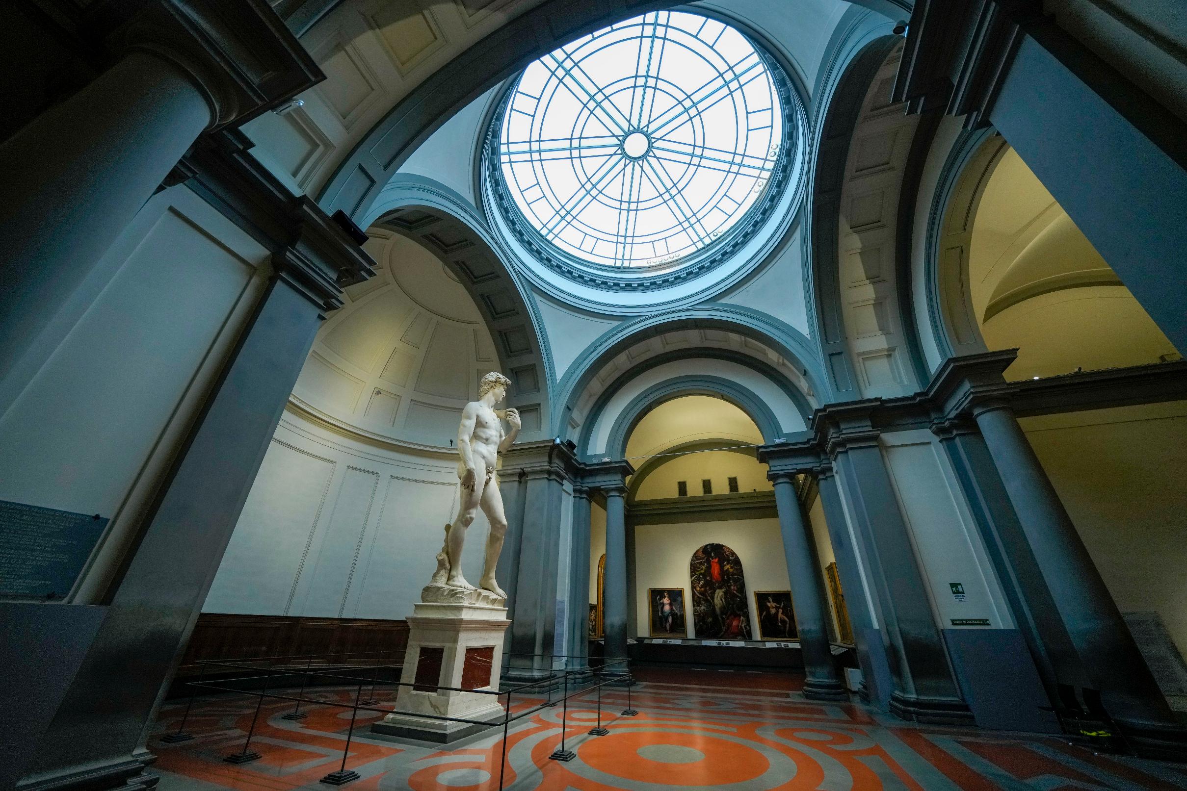 Michelangelo's 16th century statue of David is seen on display at the Accademia gallery, in Florence, central Italy, Monday, March 18, 2024. Michelangelo’s David has been a towering figure in Italian culture since its completion in 1504. But curators worry the marble statue’s religious and political significance is being diminished by the thousands of refrigerator magnets and other souvenirs focusing on David’s genitalia. The Galleria dell’Accademia’s director has positioned herself as David’s defender and takes swift aim at those profiteering from his image. (AP Photo/Andrew Medichini)