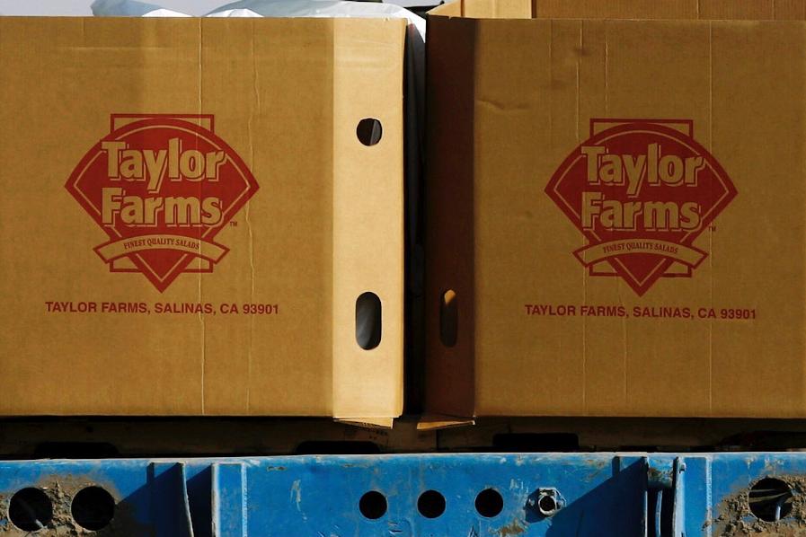 FILE - Taylor Farms boxes are loaded on a field in the town of Doctor Mora, on the central state of Guanajuato, Mexico, March 26, 2008. (AP Photo/Guillermo Arias, file)