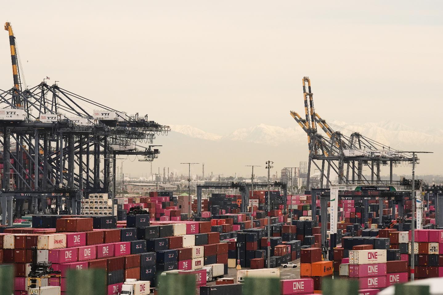 FILE - Containers are stacked at the Port of Los Angeles Friday, Feb. 20, 2026, in Los Angeles. (AP Photo/Damian Dovarganes,File)