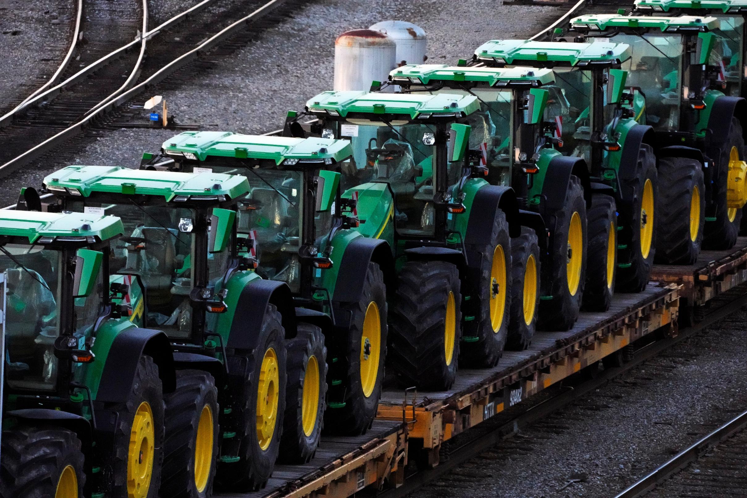 FILE - John Deere tractors sit in Norfolk Southern's Conway Yard in Conway, Pa., Dec. 5, 2022. (AP Photo/Gene J. Puskar, File)