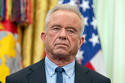 Health and Human Services Secretary Robert F. Kennedy Jr. attends an event on health care affordability in the Oval Office at the White House, Thursday, April 23, 2026, in Washington. (AP Photo/Mark Schiefelbein)
