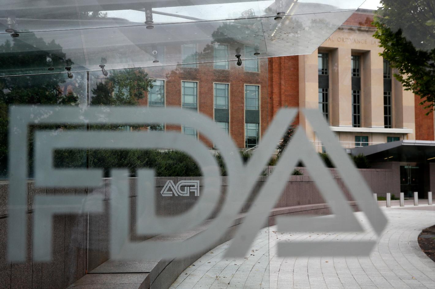 FILE - The U.S. Food and Drug Administration building behind FDA logos at a bus stop on the agency's campus in Silver Spring, Md, Thursday, Aug. 2, 2018. (AP Photo/Jacquelyn Martin, File)