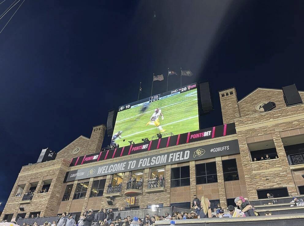 Colorado University's Folsom Field features PointsBet ads on its video board and LED message board during an during an NCAA college football game between Colorado and Arizona State in Boulder, Colo., Oct. 29, 2022. PointsBet, a Denver-based sports betting company that is a corporate sponsor of the University of Colorado Boulder’s athletics program, says it is pitching its brand to alums in Colorado and other states where fans are old enough to bet legally. (Shane Connuck/Povich Center for Sports Journalism via AP)