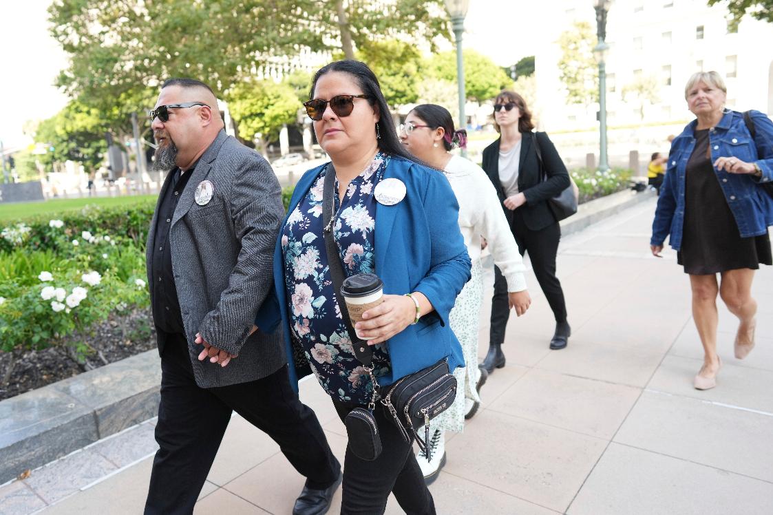 Javier Cazares, left, and Gloria Cazares arrive for a court hearing in a lawsuit between victims' families in the 2022 Uvalde, Texas school shooting and Meta Platforms on Friday, July 18, 2025, in Los Angeles. (AP Photo/Eric Thayer)