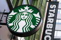 FILE - The Starbucks logo is seen on a storefront, Oct. 14, 2022, in Boston. (AP Photo/Michael Dwyer, File)