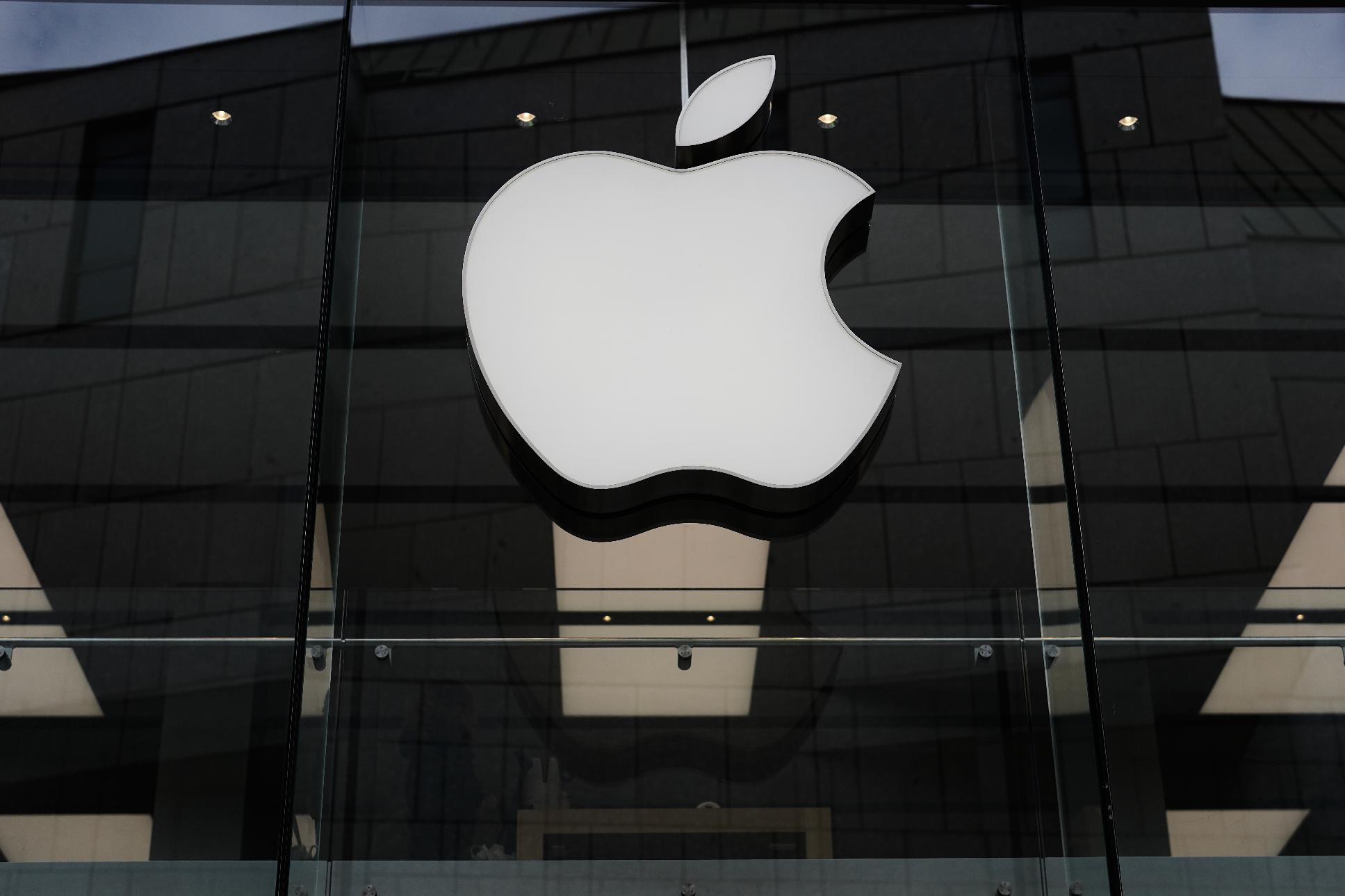 FILE - The Apple logo is illuminated at a store in Munich, April 2, 2026. (AP Photo/Matthias Schrader, File)