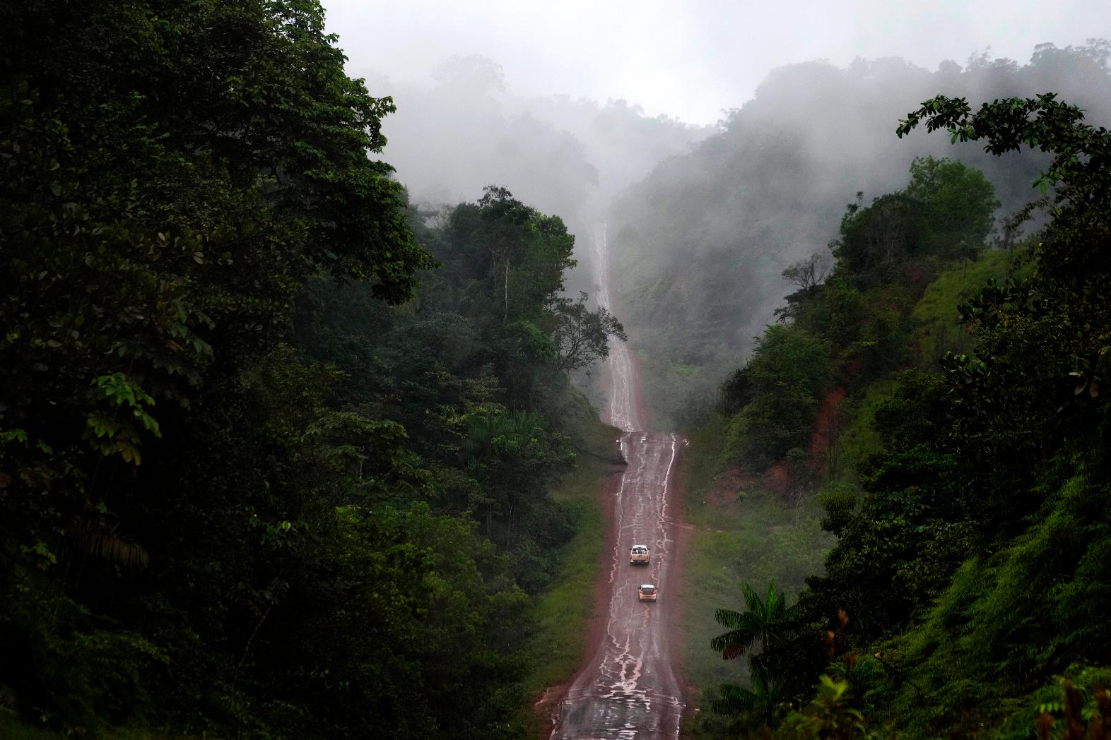 Vehicles move on an unpaved part of the BR-156 highway that connects the state capital Macapa with the city of Oiapoque, Amapa state, Brazil, Friday, March 13, 2026. (AP Photo/Eraldo Peres)