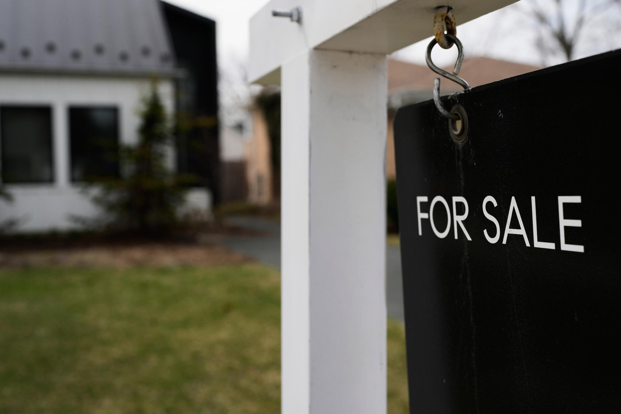 A House For Sale sign is displayed in front of a home in Evanston, Ill.,Wednesday, March 25, 2026. (AP Photo/Nam Y. Huh)