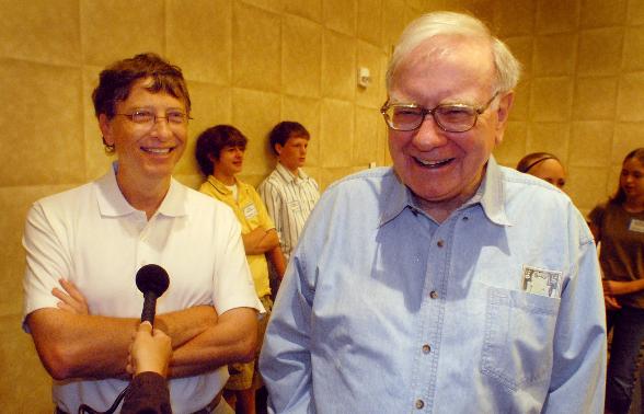 FILE - Microsoft co-founder and chairman Bill Gates, left, and Berkshire Hathaway Inc. billionaire Warren Buffett laugh while answering questions Aug 5, 2006, before the Nebraska Regional Bridge tournament in Council Bluffs, Iowa. (AP Photo/Dave Weaver, File)