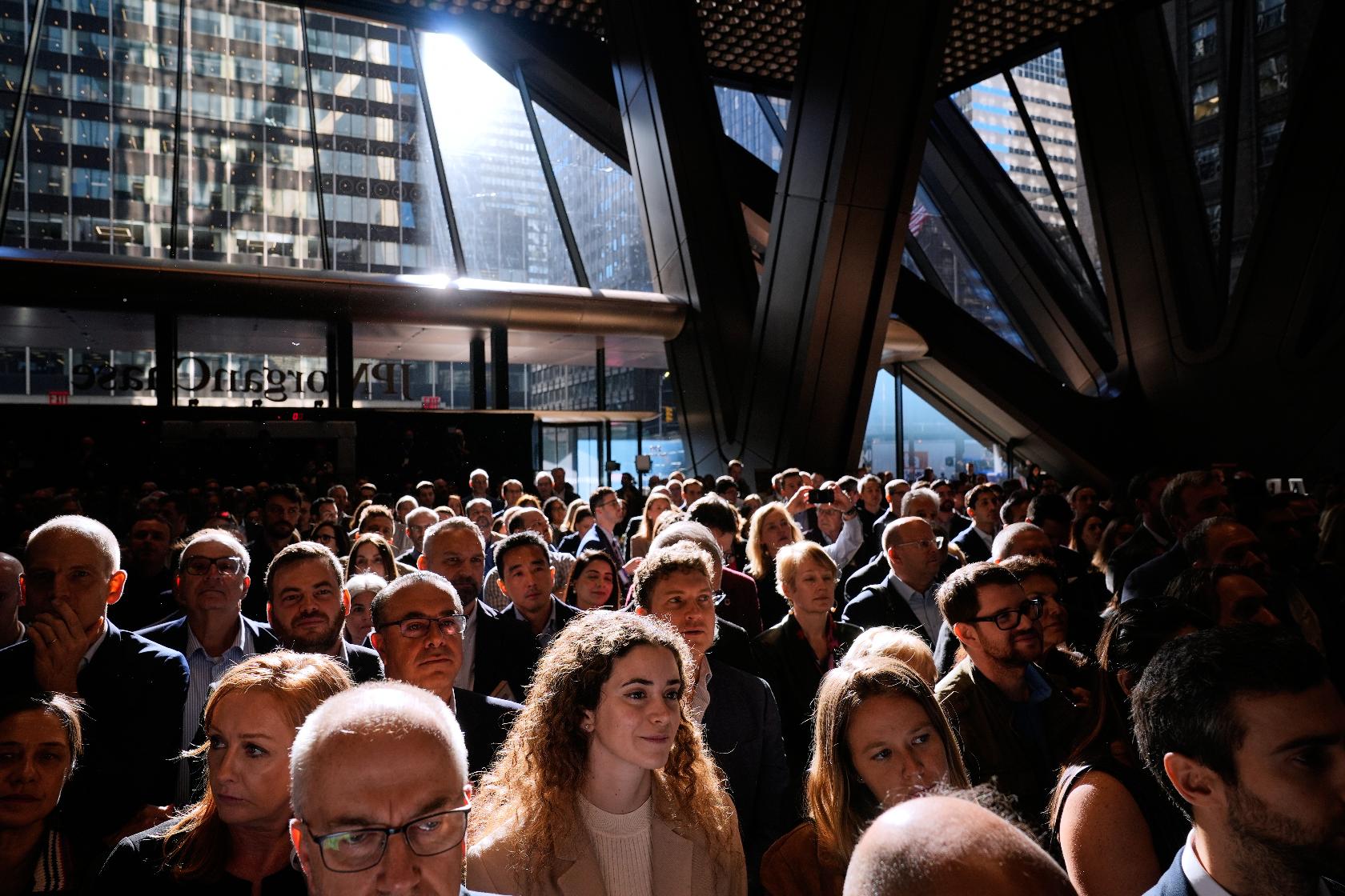 JPMorgan Chase employees and supporters listen to speeches in the lobby of the new building during a ribbon cutting ceremony in New York, Tuesday, Oct. 21, 2025. (AP Photo/Seth Wenig)