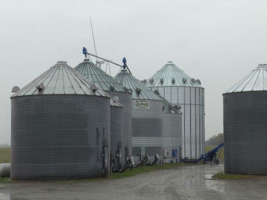 Grain bins stand on the farm that Bryant Kagay works with his father and grandfather in Amity, Missouri, Friday, April 4, 2025. (AP Photo/Nick Ingram)