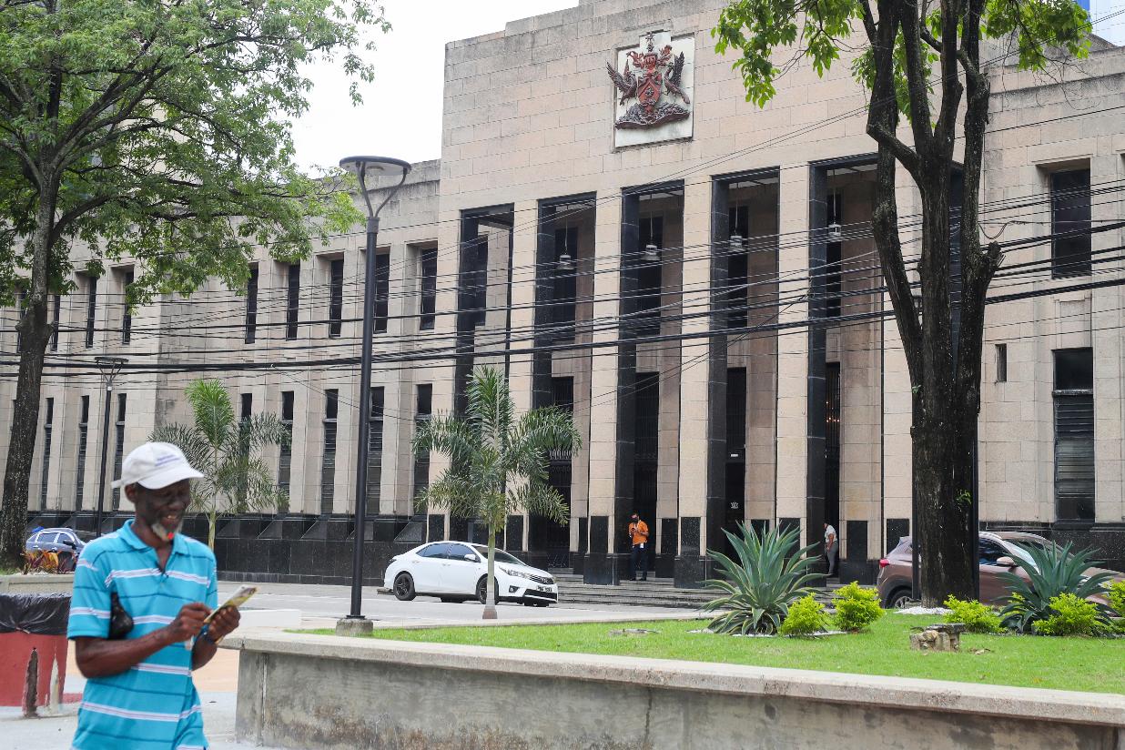 FILE - The country's coat of arms is displayed on the facade of a government building in Port-of-Spain, Trinidad and Tobago, Aug. 20, 2024. (AP Photo/Ash Allen, File)