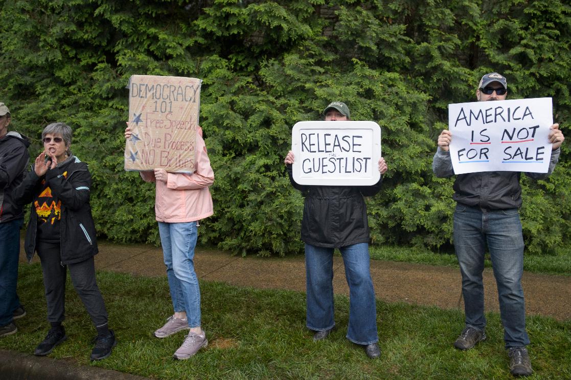 Demonstrators protest near Trump National Golf Club Washington DC before the arrival of President Donald Trump in Sterling, Va., Thursday, May 22, 2025. (AP Photo/Rod Lamkey, Jr.)