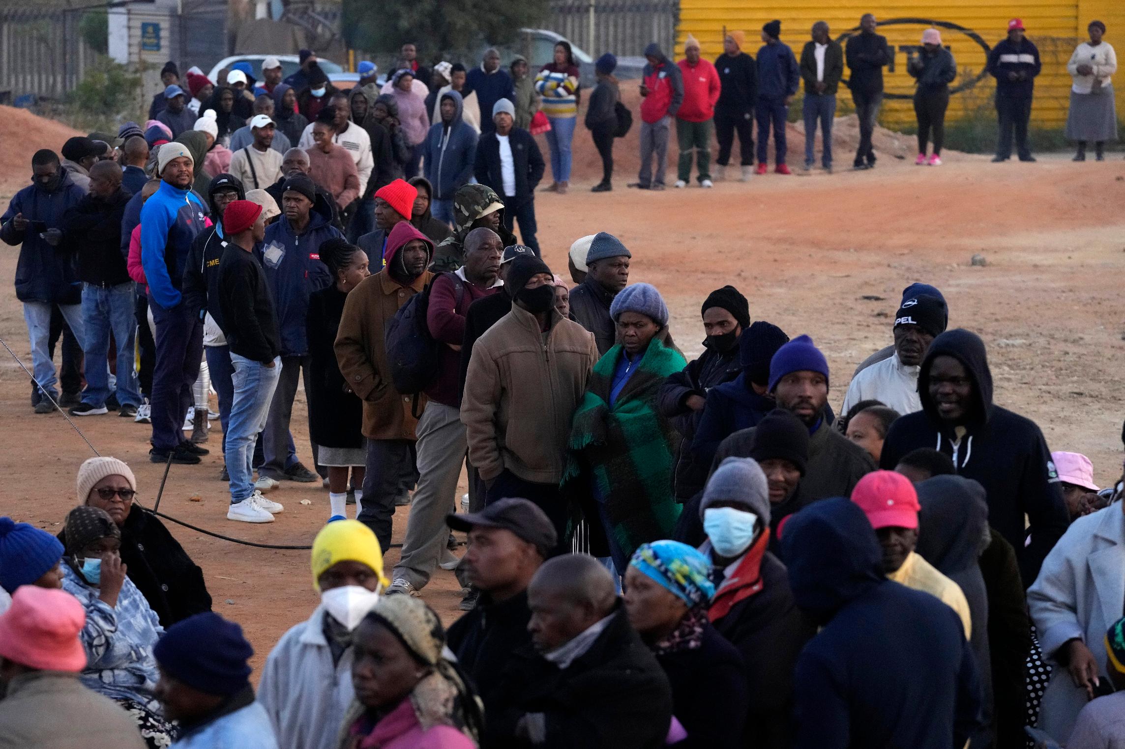 FILE - Voters line up to cast their ballot for general elections in Alexandra, near Johannesburg, South Africa, May 29, 2024. (AP Photo/Themba Hadebe, File)
