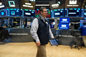 Michael Capolino works on the floor at the New York Stock Exchange in New York, Thursday, March 19, 2026. (AP Photo/Seth Wenig)