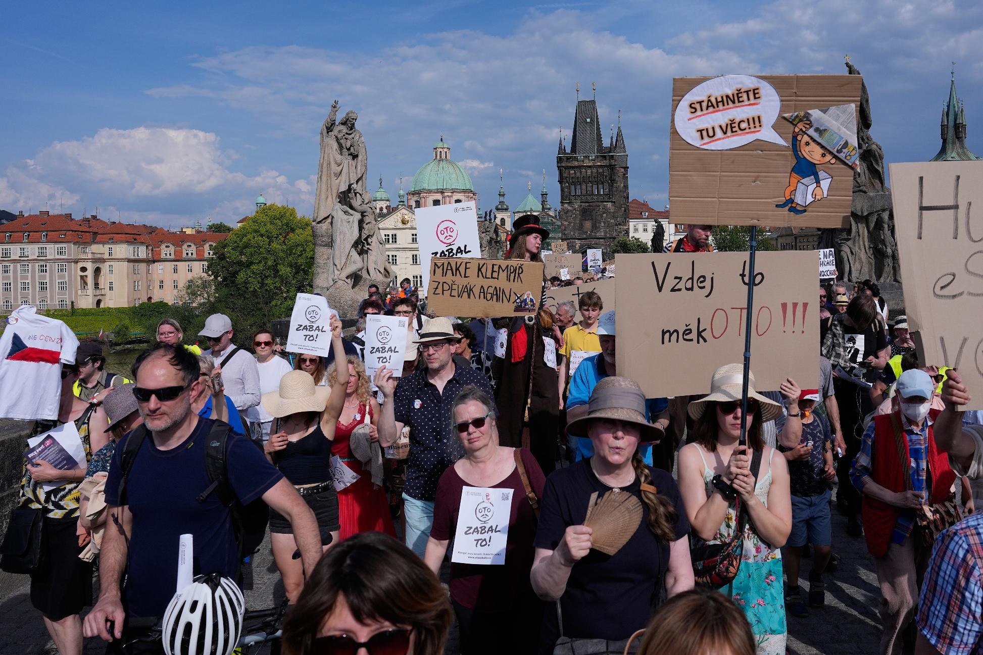 Thousands of people march to protest against a government plan to change public broadcaster funding in Prague, Czech Republic, Sunday, May 24, 2026. (AP Photo/Petr David Josek)