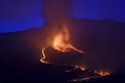Lava flows from a volcano on the Canary island of La Palma, Spain in the early hours of Sunday Sept. 26, 2021. A volcano in Spain's Canary Islands is keeping nerves on edge several days since it erupted, producing loud explosions, a huge ash cloud and cracking open a new fissure that spewed out more fiery molten rock. (AP Photo/Daniel Roca)