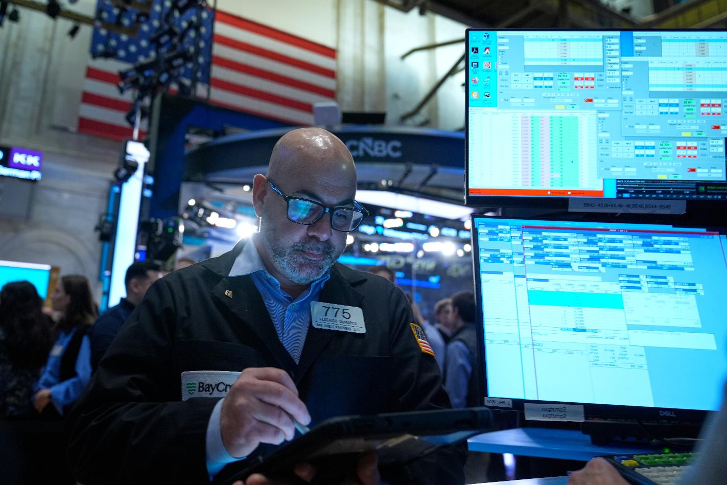 Federico DeMarco works on the floor at the New York Stock Exchange in New York, Tuesday, March 10, 2026. (AP Photo/Seth Wenig)