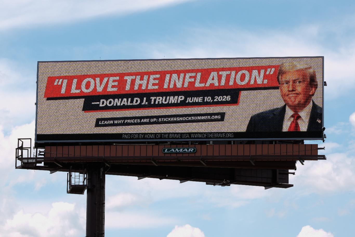 An electronic billboard with an image of President Donald Trump reads "I love the inflation." - Donald J. Trump June 10, 2026," is seen near I-74 in Cincinnati, Tuesday, June 16, 2026. (AP Photo/Carolyn Kaster)