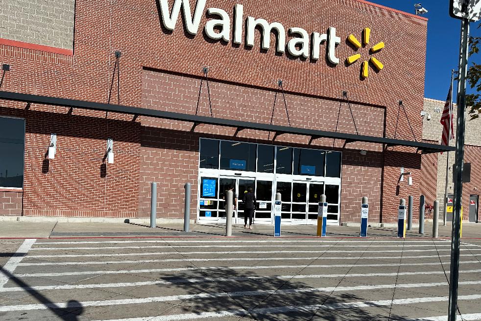 FILE - A shopper heads into a Walmart store Thursday, Oct. 16, 2025, in Englewood, Colo. (AP Photo/David Zalubowski, File)