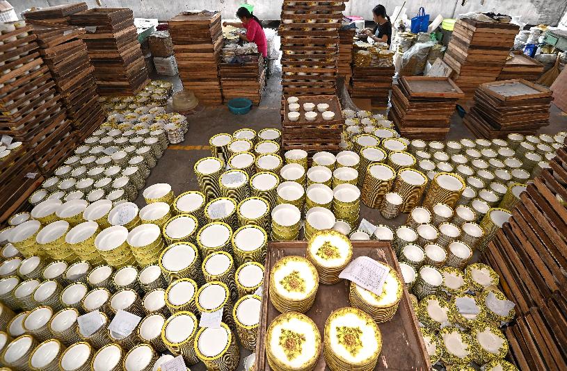 FILE - Workers labor at a ceramic ware factory, in Handan in north China's Hebei province on Nov. 4, 2025. (Chinatopix Via AP, File)