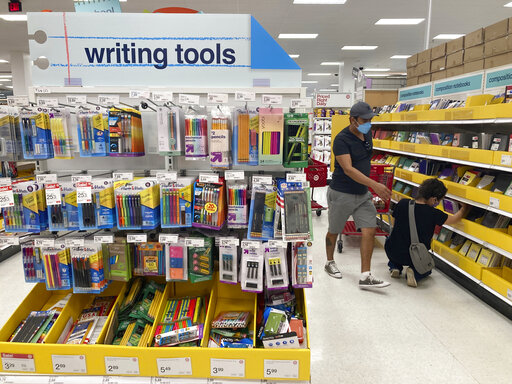 FILE - Shoppers look for school supplies at a store, Wednesday, July 27, 2022, in South Miami, Fla. Economists are saying strong consumer demand, spurred by rising wages, is fueling inflation. (AP Photo/Marta Lavandier, File)