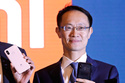 FILE - Xiaomi Executive Director and President Lin Bin is seen at a news conference in Hong Kong on June 23, 2018. (AP Photo/Kin Cheung, File)